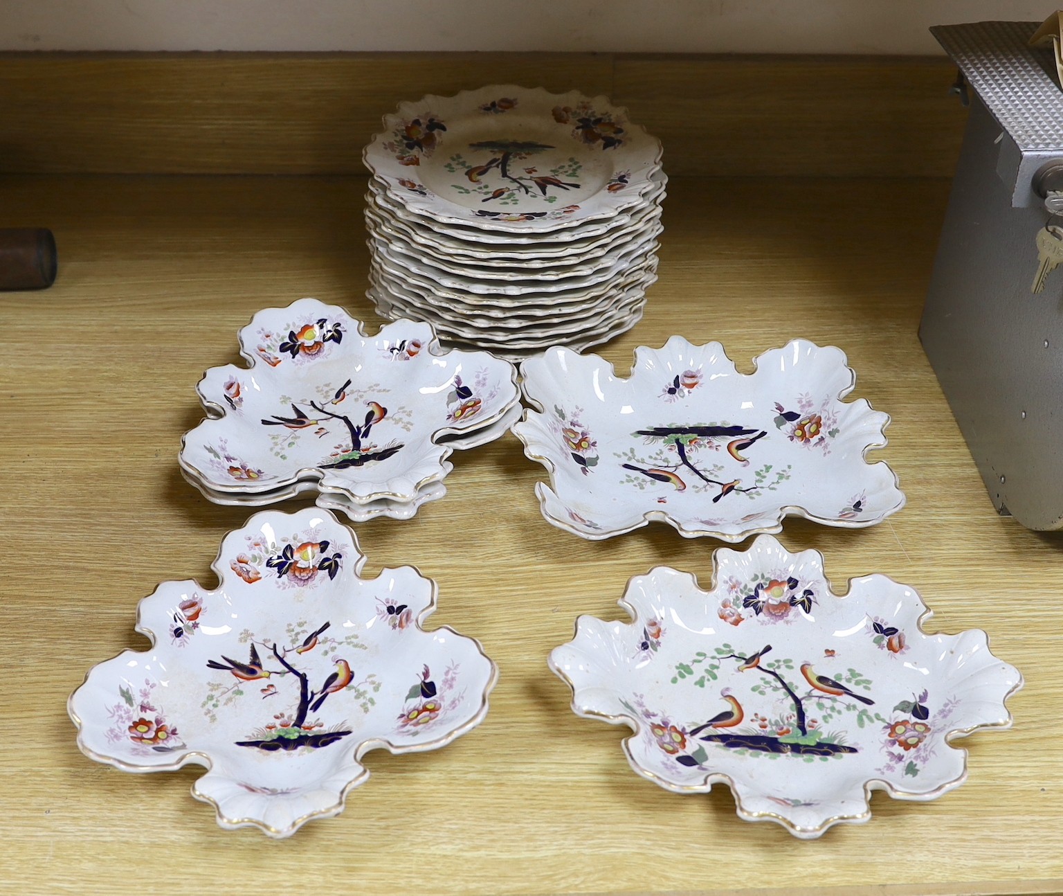 A mid 19th century opaque china dessert service by W. Baker & Co.